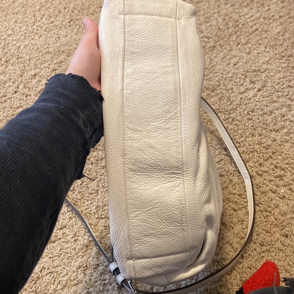 Im selling this Michael Kors purse. It’s white with silver accents! Two straps! - Picture 7 of 7